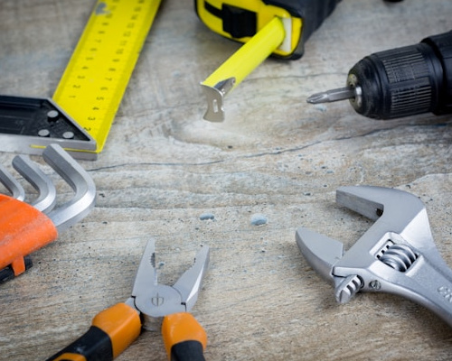 https://unsplash.com/photos/a-variety-of-tools-are-sitting-on-a-table-iwz5tmhjl7o